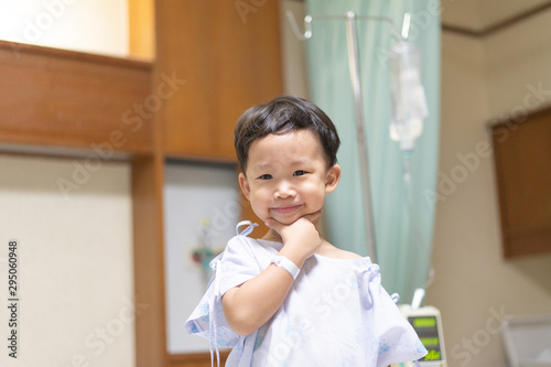 The patient boy is happy in the hospital, He has a cheerful heart.