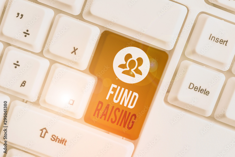 Handwriting text writing Fund Raising. Conceptual photo the act of seeking to generate financial support for a charity White pc keyboard with empty note paper above white background key copy space Handwriting text writing Fund Raising. Conceptual photo the act of seeking to generate financial support for a charity White pc keyboard with empty note paper above white background key copy space