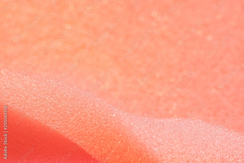 White and Pink artificial foam, foam texture on a light background.