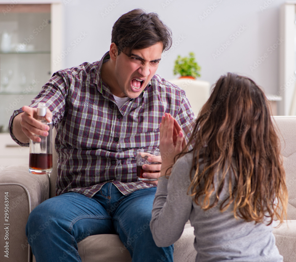 Domestic violence concept in a family argument with drunk alcoho Domestic violence concept in a family argument with drunk alcoho