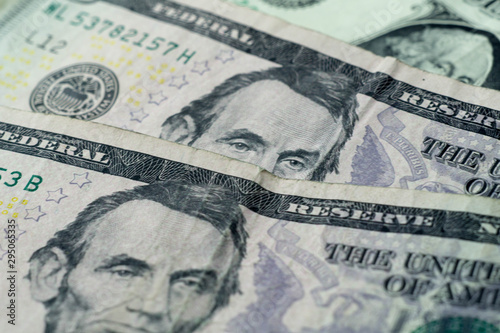 eyes peeking over dollar bills investment concept