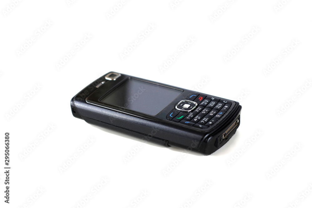 an old black cellphone with white screen at isolated background, ก-ฮ on the keyboard are Thai alphabet. an old black cellphone with white screen at isolated background, ก-ฮ on the keyboard are Thai alphabet.