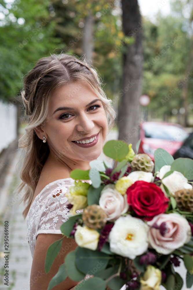 Colourful bouquet and bride