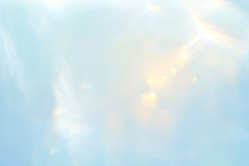delicate abstract pastel blue background with gold sequins copy