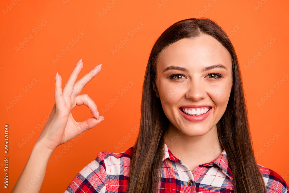 Close-up portrait of her she nice attractive lovely cheerful cheery content straight-haired girl freelancer showing ok-sign isolated on bright vivid shine vibrant orange color background - obrazy, fototapety, plakaty 