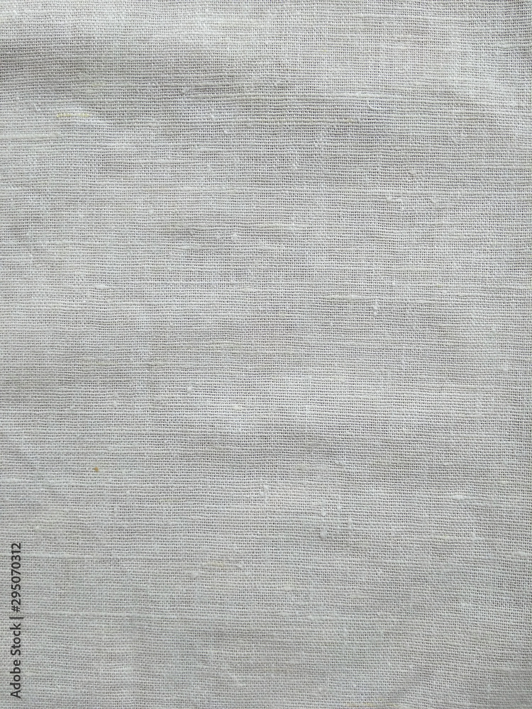 Dark white canvas with fold marks. Abstract background of crumpled cheesecloth. Close up Dark white canvas with fold marks. Abstract background of crumpled cheesecloth. Close up