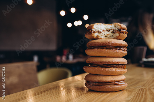 Close up Traditional chocolate and Pumpkin Whoopie pies filled made with vanilla cream cheese frosting cream photo