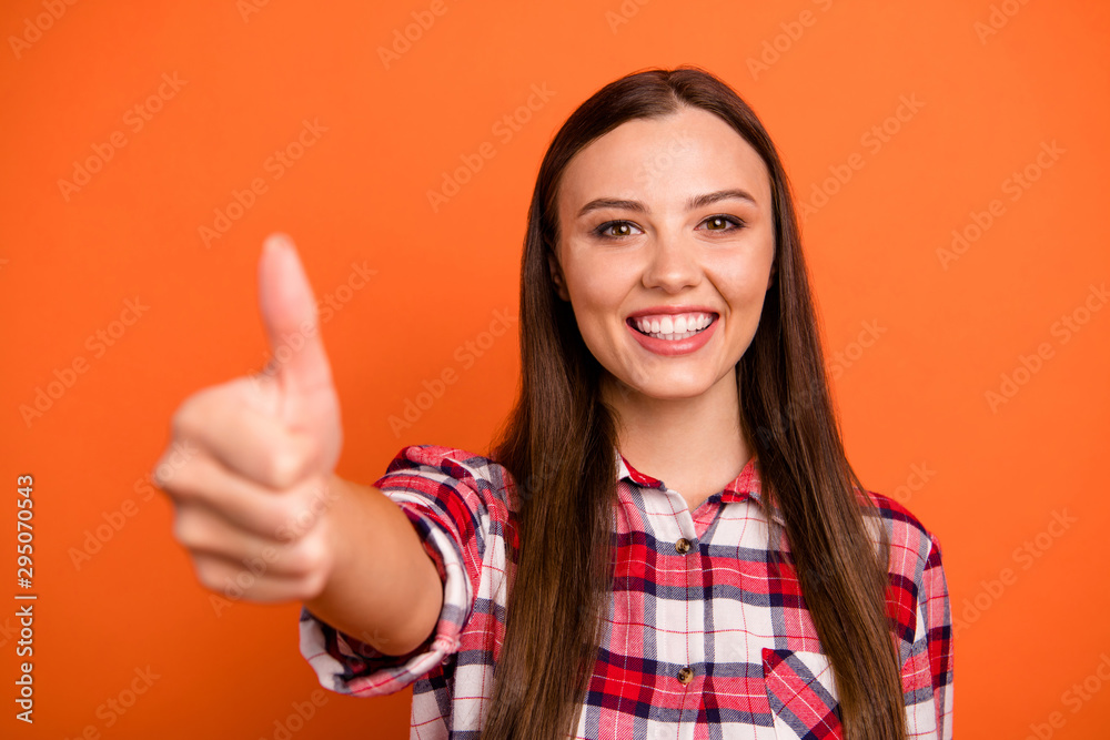 Close-up portrait of her she nice attractive cheerful cheery content straight-haired girl freelancer giving thumbup excellent isolated on bright vivid shine vibrant orange color background Close-up portrait of her she nice attractive cheerful cheery content straight-haired girl freelancer giving thumbup excellent isolated on bright vivid shine vibrant orange color background