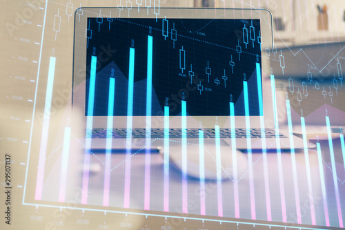 Financial market graph hologram and personal computer on background. Double exposure. Concept of forex. © peshkova