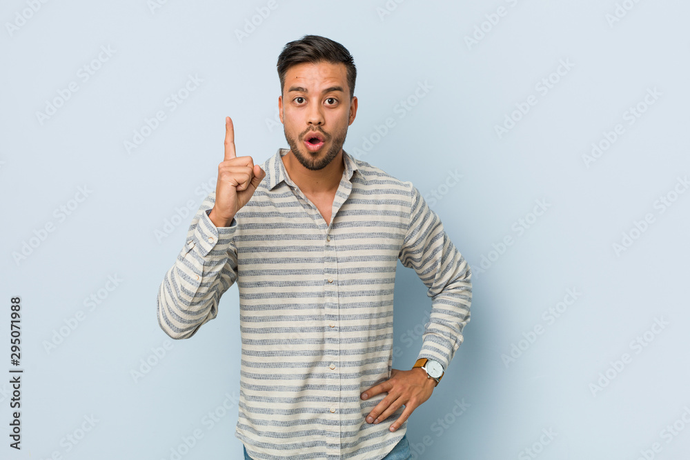 Young handsome filipino man having an idea, inspiration concept. Young handsome filipino man having an idea, inspiration concept.
