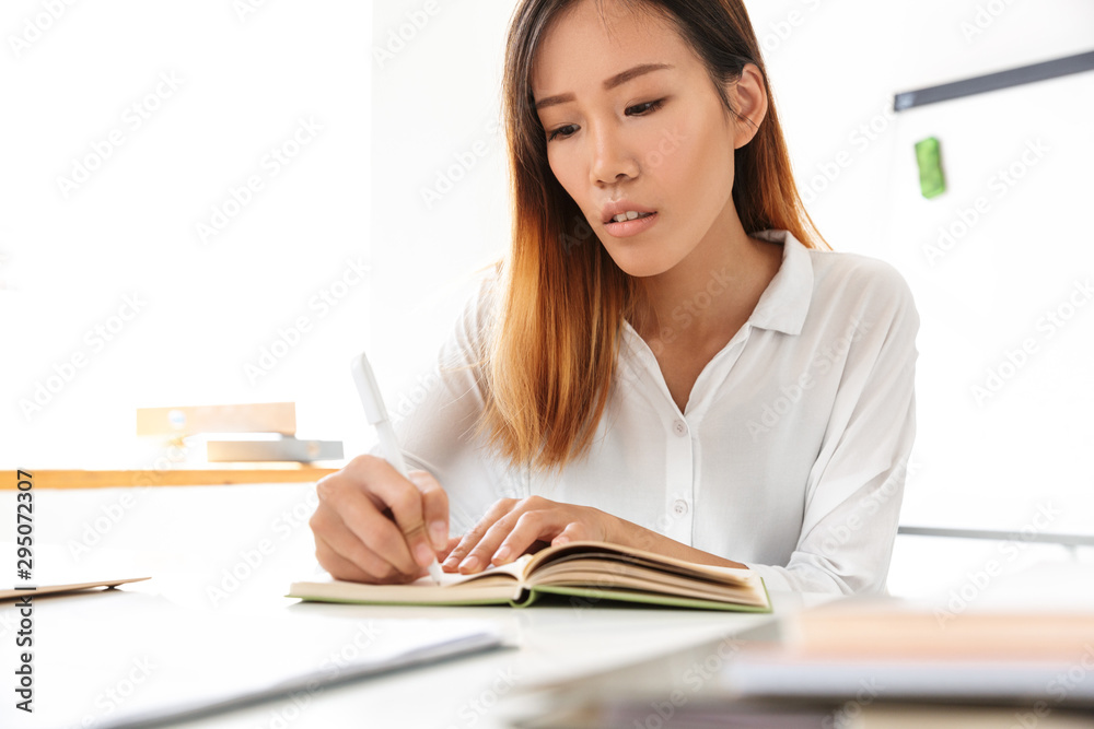 Attractive young asian businesswoman working Attractive young asian businesswoman working