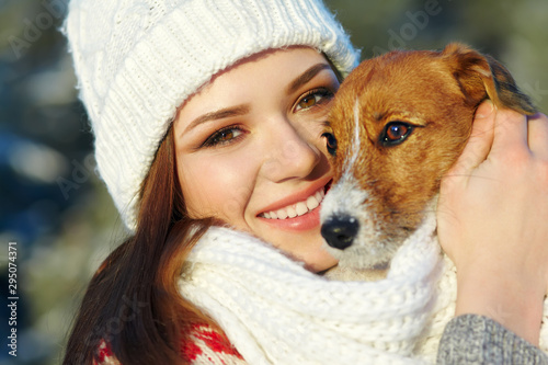 Jack Russell Terrier dog with owner in the winter outdoors © bakharev