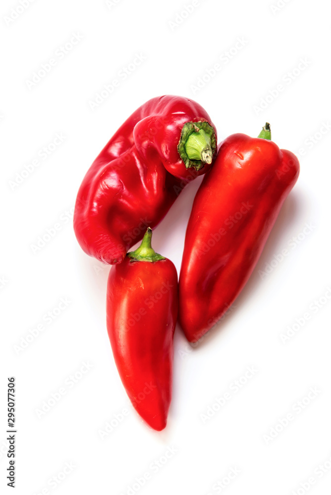 Red kapya peppers isolated on white background, close up Red kapya peppers isolated on white background, close up
