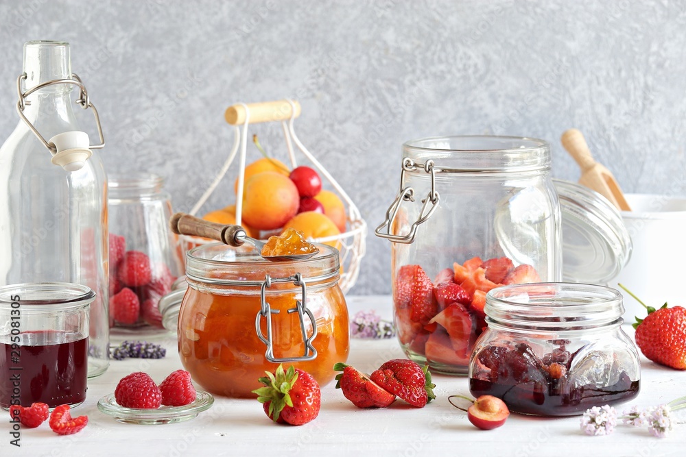 Apricot lavender marmalade in a glass jar on a rustic wooden table Apricot lavender marmalade in a glass jar on a rustic wooden table