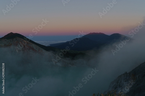 First light with fog. Sunrise on on the mountain Ijen Java ,Indonesia.