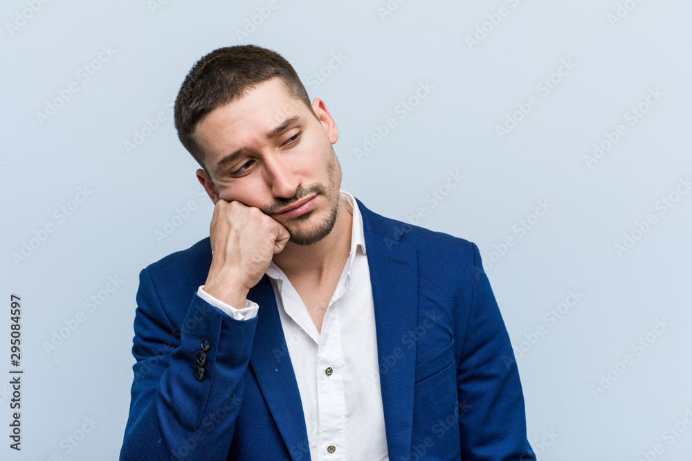 Young business caucasian man who feels sad and pensive, looking at copy space. Young business caucasian man who feels sad and pensive, looking at copy space.