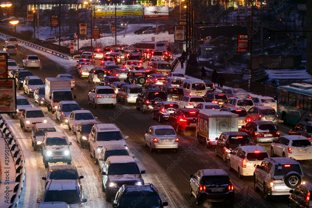Car traffic jams due to snowfall in the evening. Car traffic jams due to snowfall in the evening.