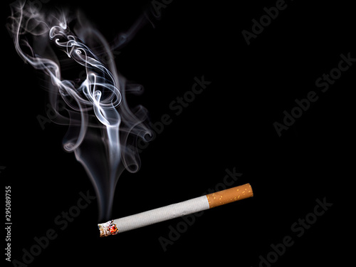 Close up of a cigarette with smoke showing