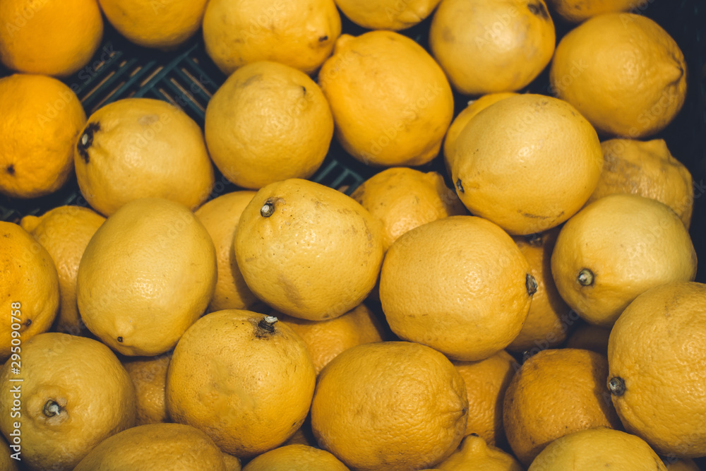 lemons texture background selling fruit at the market tinted photo lemons texture background selling fruit at the market tinted photo