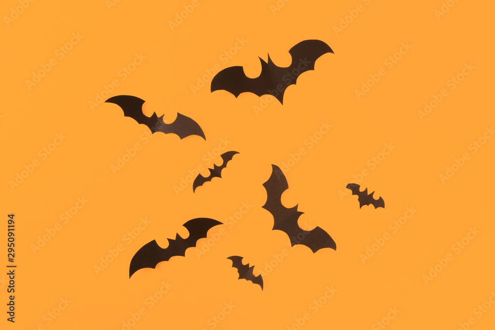 Halloween paper decorations on orange background. Halloween concept. Flat lay, top view, copy space - Image