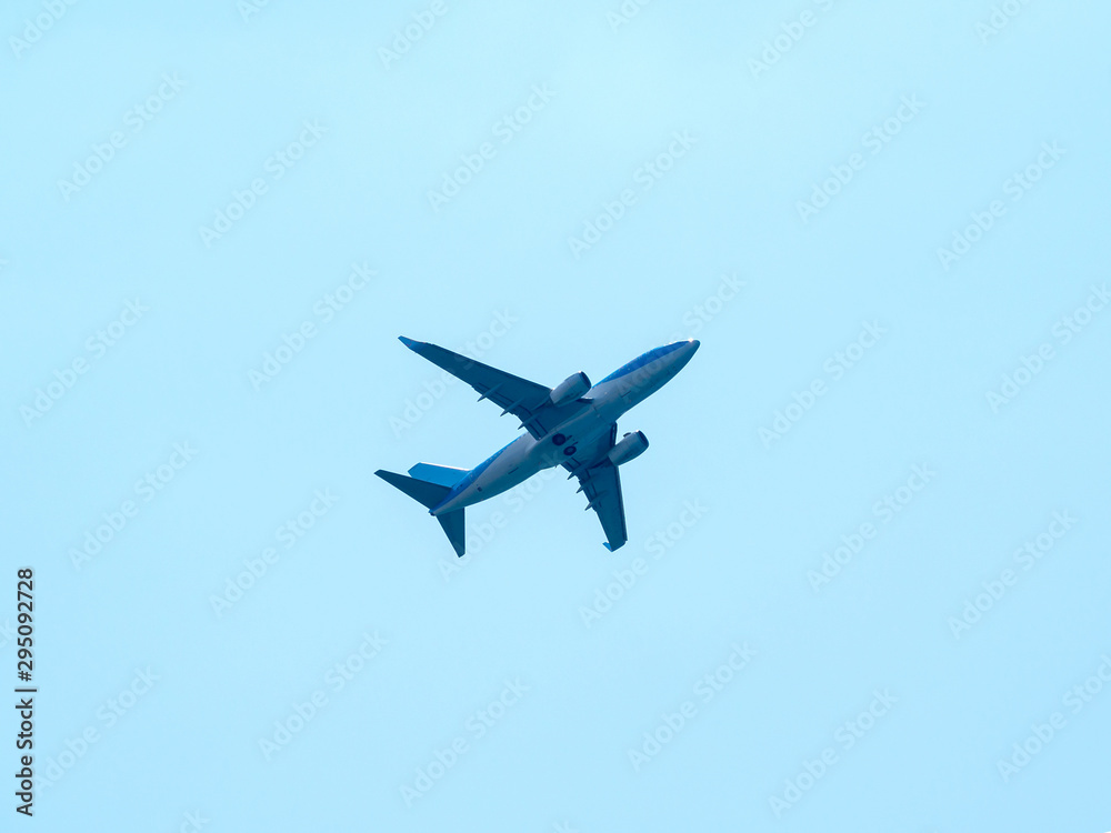 Plane wing land high on blue background Plane wing land high on blue background