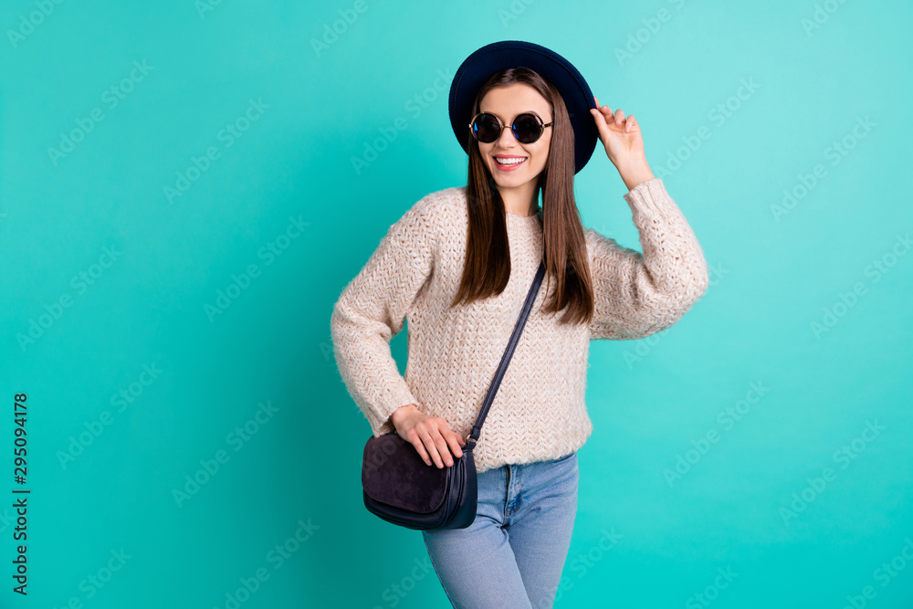 Portrait of lovely enthusiastic cute girl have free time go walk enjoy wear denim jeans knitted pullover isolated over teal turquoise color background Portrait of lovely enthusiastic cute girl have free time go walk enjoy wear denim jeans knitted pullover isolated over teal turquoise color background