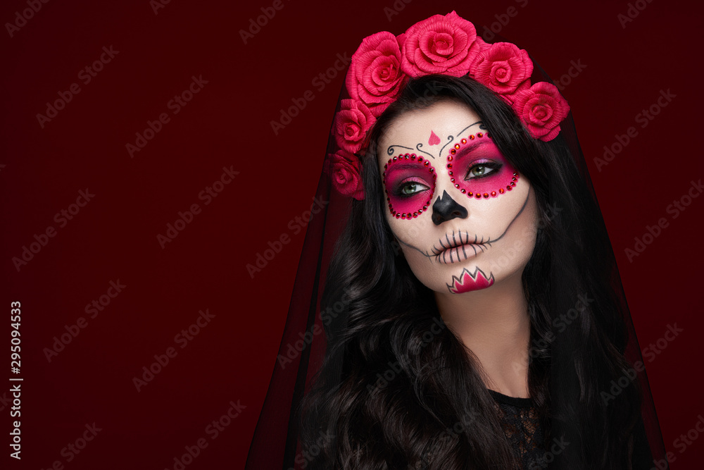 Portrait of a woman with sugar skull makeup over red background. Halloween  costume and make-up. Portrait of Calavera Catrina Stock Photo | Adobe Stock