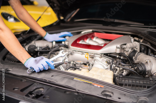 Professional mechanic checking car engine ,Auto mechanic working in garage. Repair service. © Amnatdpp