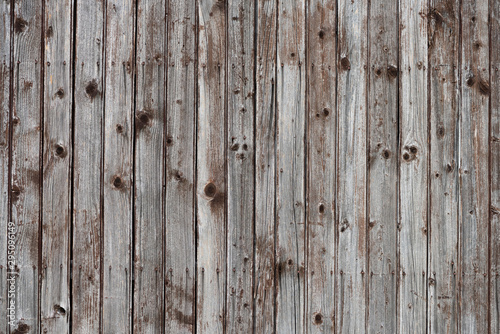 Old rustic wooden wall background planks weathered with nails