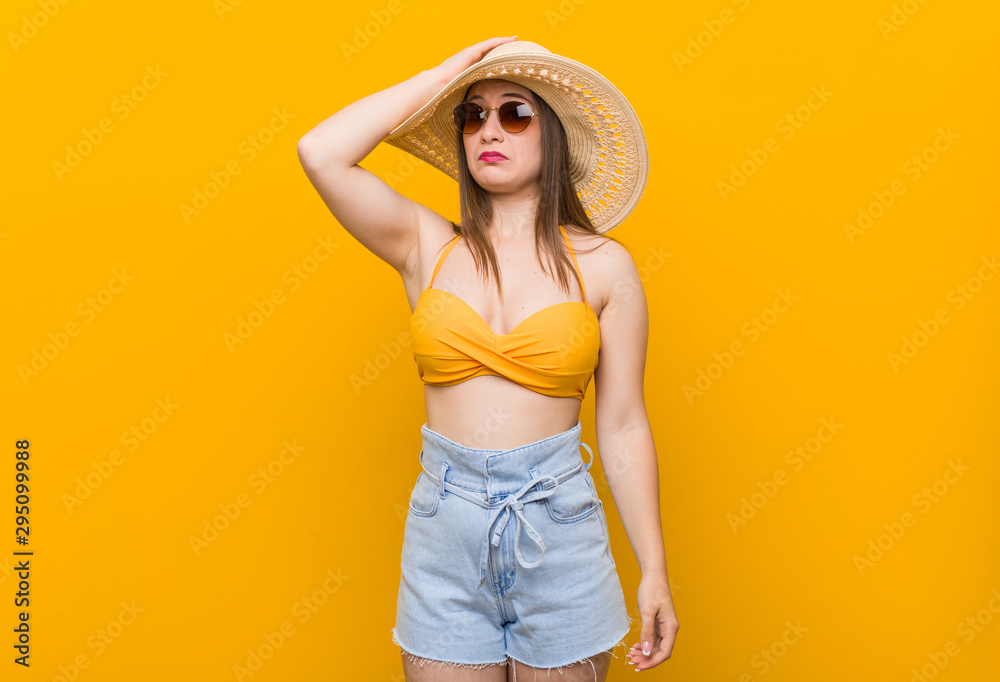 Young caucasian woman wearing a straw hat, summer look being shocked, she has remembered important meeting. Young caucasian woman wearing a straw hat, summer look being shocked, she has remembered important meeting.
