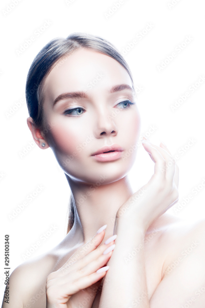 Beauty model woman apply cream on face with hand, healthy perfect skin, nude natural make-up. Isolated. White background. Copy space