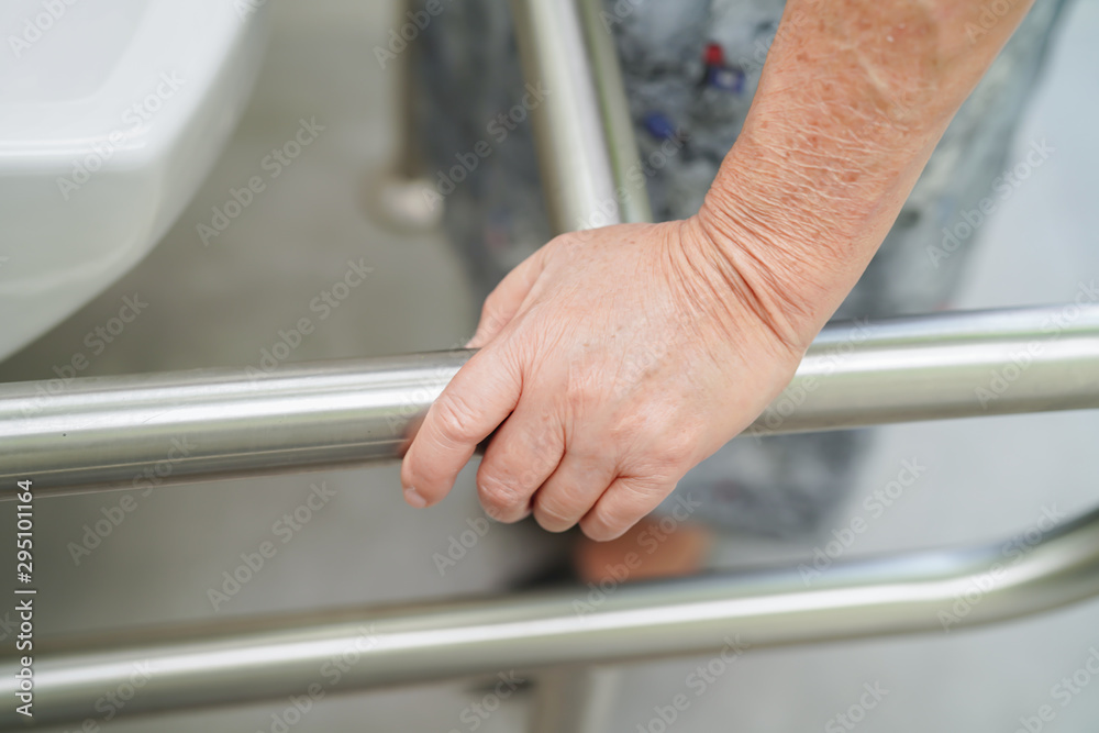 Asian senior or elderly old lady woman patient use toilet bathroom handle security in nursing hospital ward : healthy strong medical concept.  .