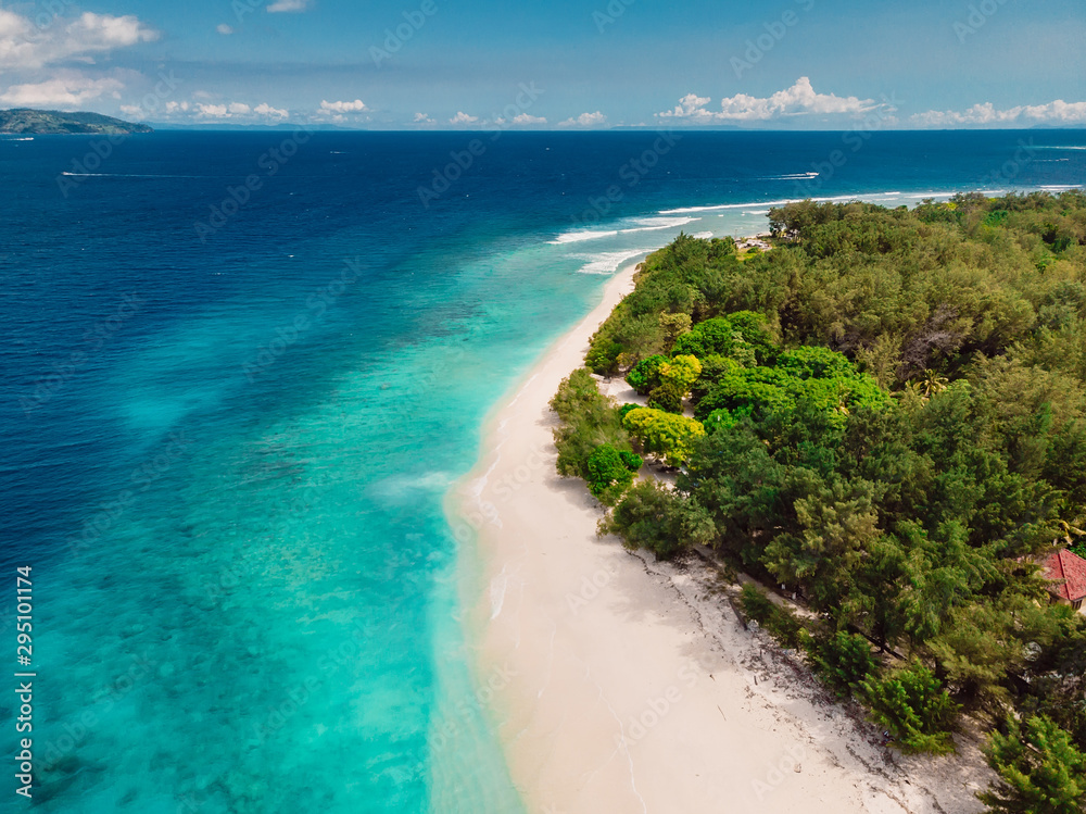 Tropical island with paradise beach and turquoise ocean. Aerial view. Gili island Tropical island with paradise beach and turquoise ocean. Aerial view. Gili island