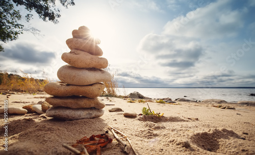Photography zen stones stacked at sea with backlight