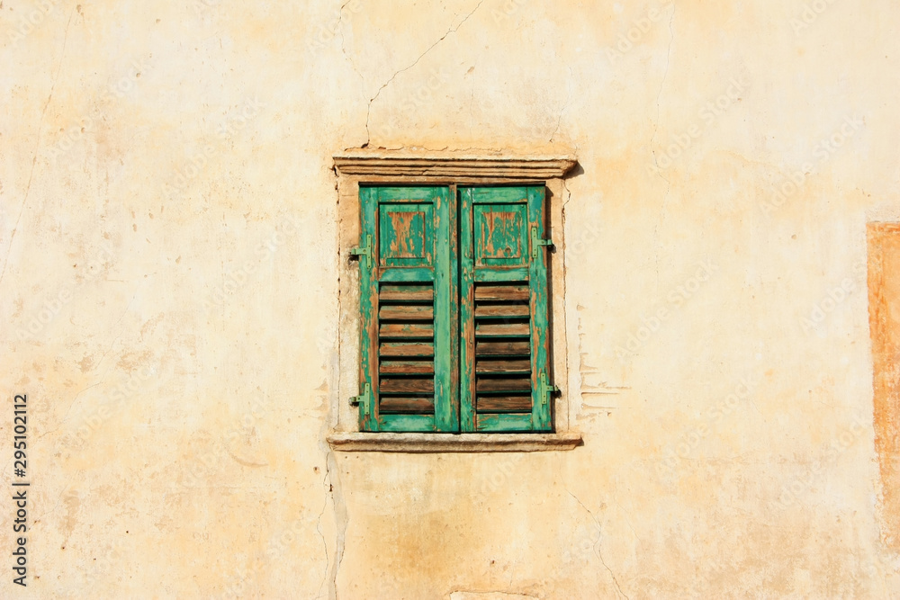 Old window with green shutters