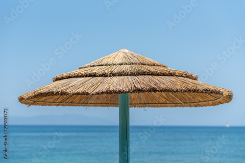 Fototapeta Naklejka Na Ścianę i Meble -  Reedy parasol during vacation on Kos Greece