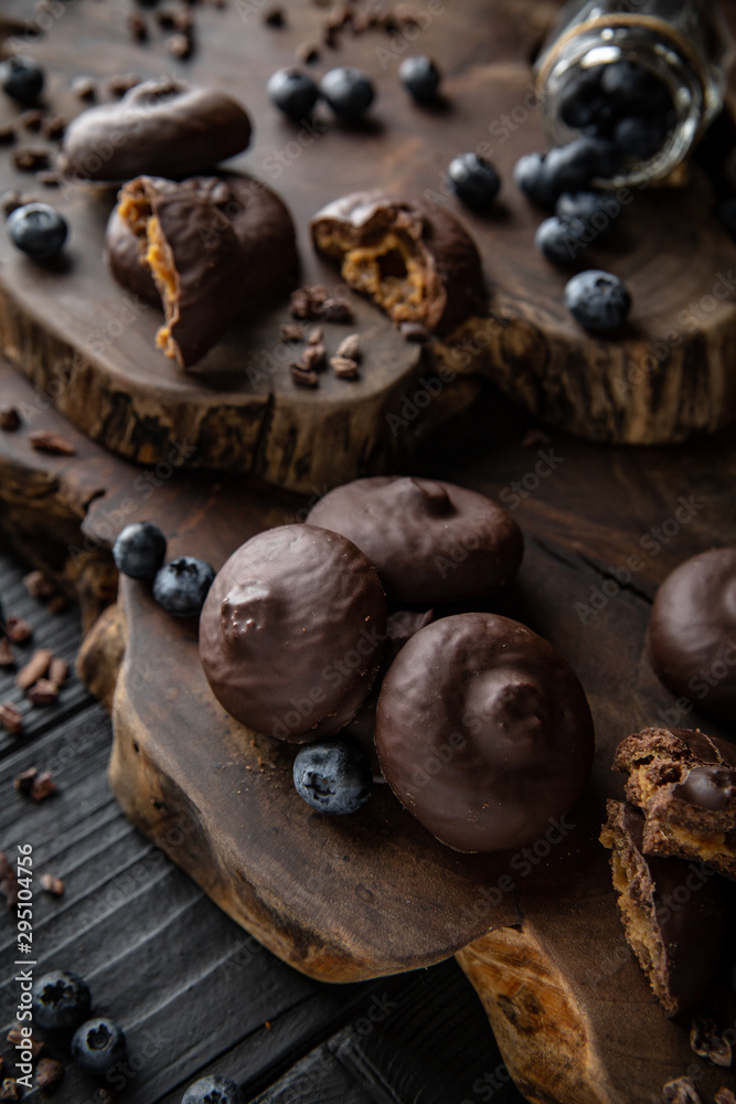 Chocolate biscuit. Crispy and crumbly delicious cookies with natural ingredients: flour, nuts, seeds, pieces of chocolate, cocoa, fruit jams. Beautiful wallpaper. Stylish still life for poster. Chocolate biscuit. Crispy and crumbly delicious cookies with natural ingredients: flour, nuts, seeds, pieces of chocolate, cocoa, fruit jams. Beautiful wallpaper. Stylish still life for poster.