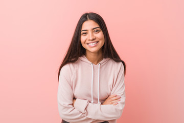 Young pretty arab woman wearing a casual sport look laughing and having fun.