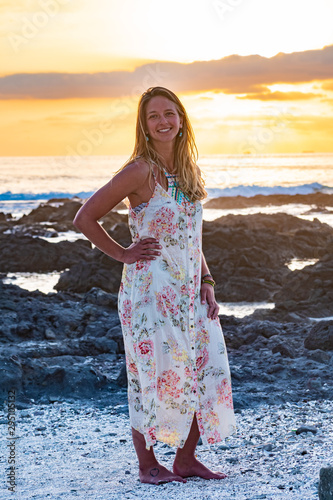 blonde woman at sunset on the beach