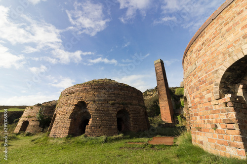 Beehive brick kilns & chimney at the abandoned Porth Wen Brickworks on the Isle of Anglesey, North Wales photo