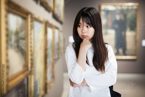 Free Download Chinese woman near picture collection in museum - GFXLoad