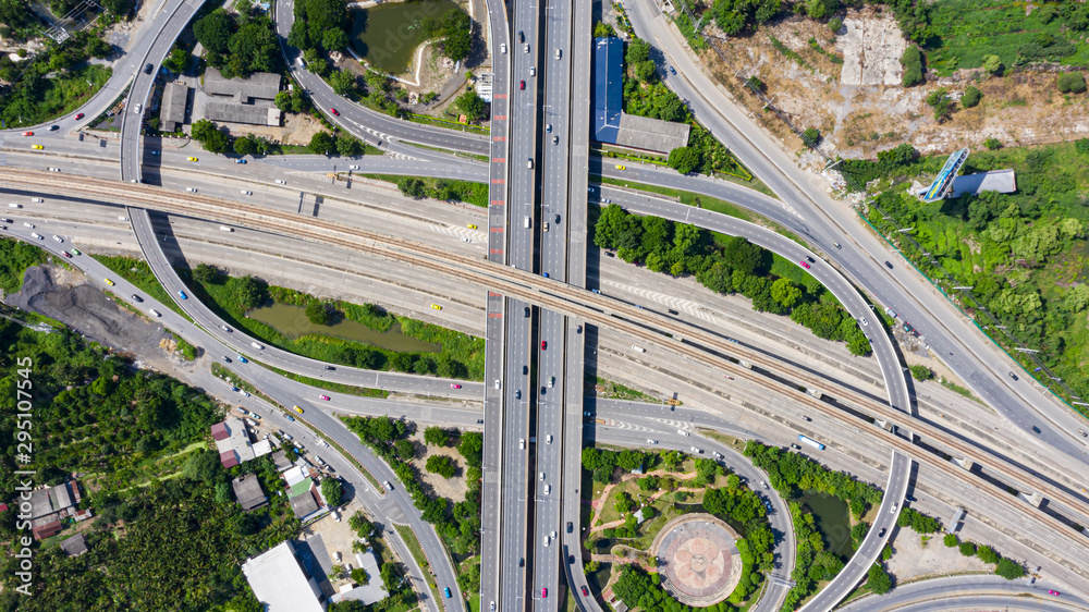 Rail track and conductor rail top view, Road Expressway traffic an important infrastructure with moving cars and railway tracks on which the train rides in Bangkok Thailand. Rail track and conductor rail top view, Road Expressway traffic an important infrastructure with moving cars and railway tracks on which the train rides in Bangkok Thailand.