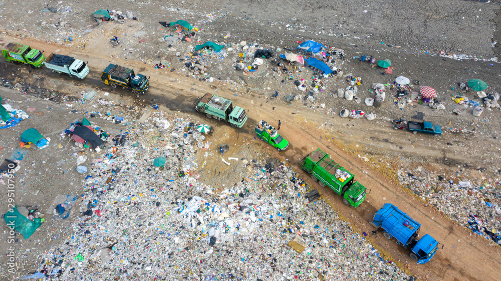 Garbage trucks unload garbage to open landfill, Surface and subsurface