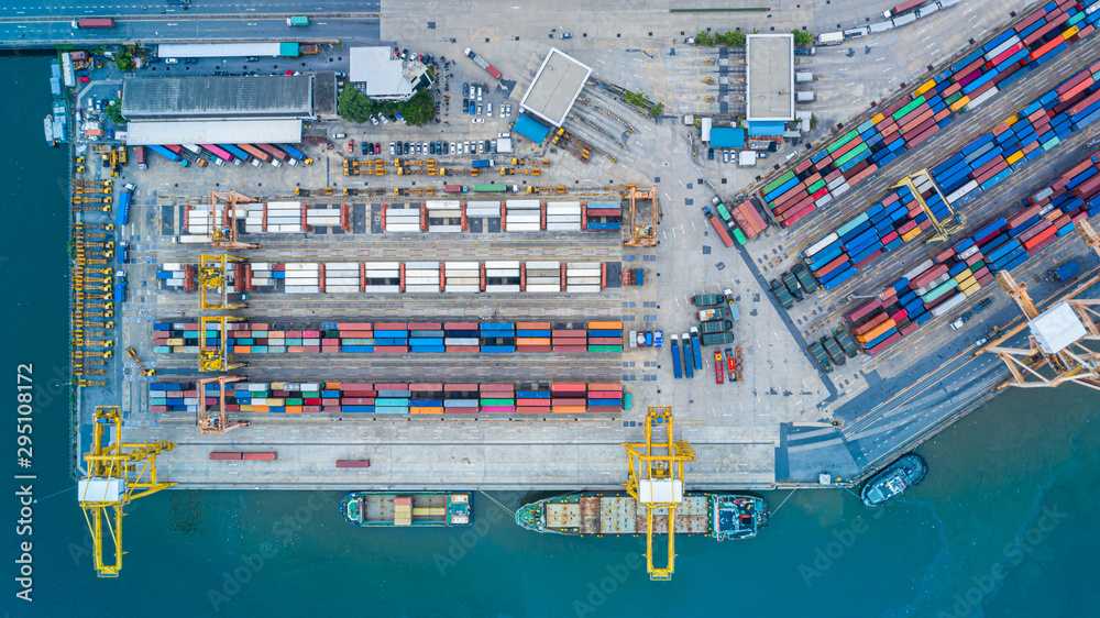 Cargo container in factory harbor at industrial estate for import export around in the world, Trade Port / Shipping - cargo to harbor. Aerial view of sea freight, Cargo ship,