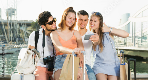 Group of travellers smiling and making selfie © JackF