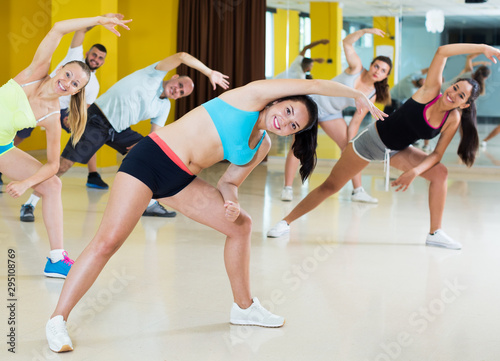 People exercising in fitness center