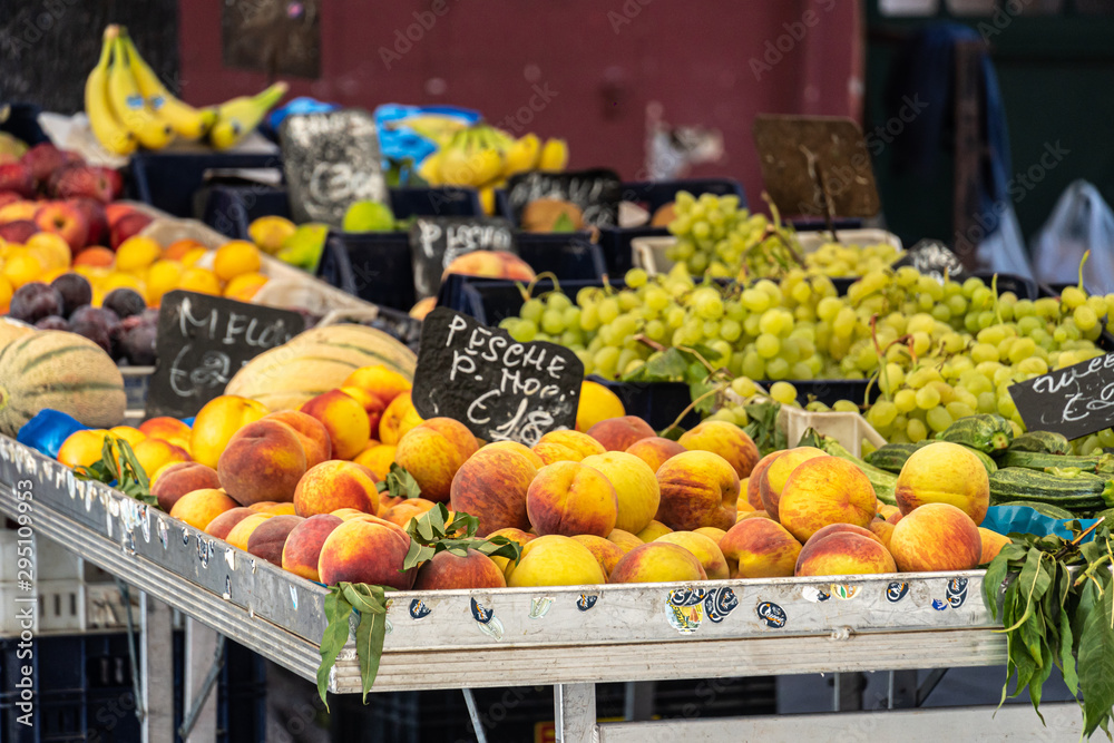 Fresh peaches, grapes and other fruits at farmers' market