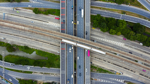 Rail track and conductor rail top view, Road Expressway traffic an important infrastructure with moving cars and railway tracks on which the train rides in Bangkok Thailand.
