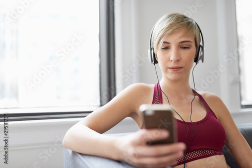 Trendy woman listening to a meditaion app as part of her mindfulness morning routine photo