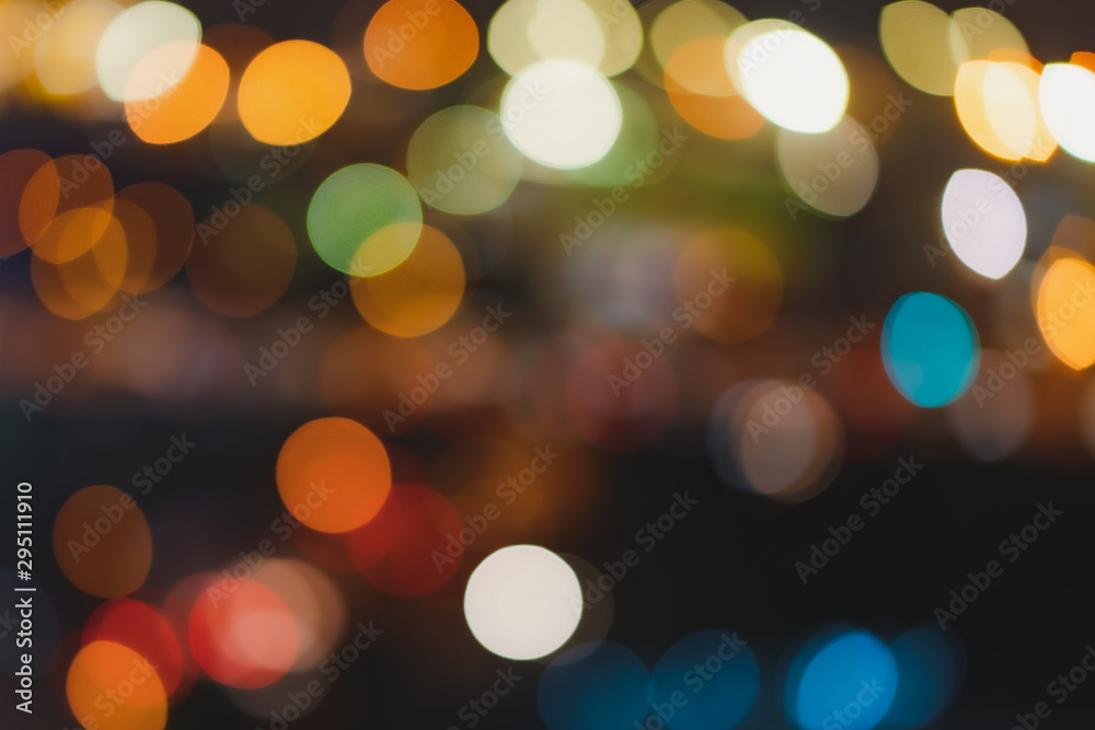 Abstract Bokeh Blurred Color Light in the city night. Glitter Background. Defogused. Abstract Bokeh Blurred Color Light in the city night. Glitter Background. Defogused.
